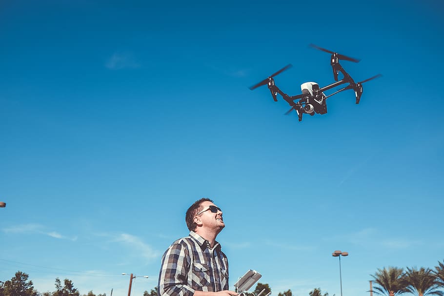 man-flying-drone